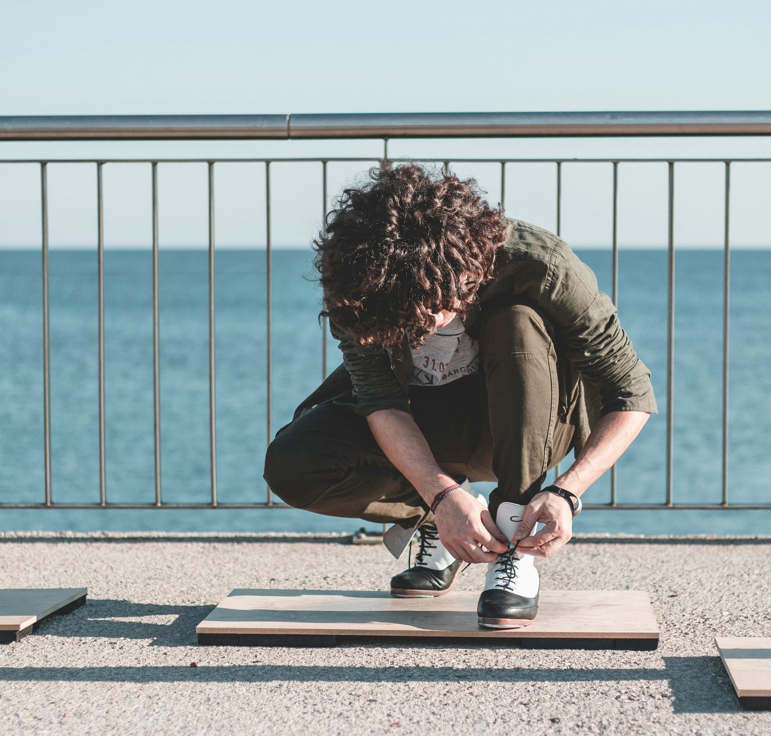 Tap dancer tying shoes
