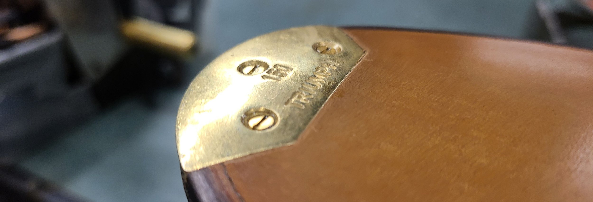 Metal toe plate secured with screws and recessed flush into a leather sole